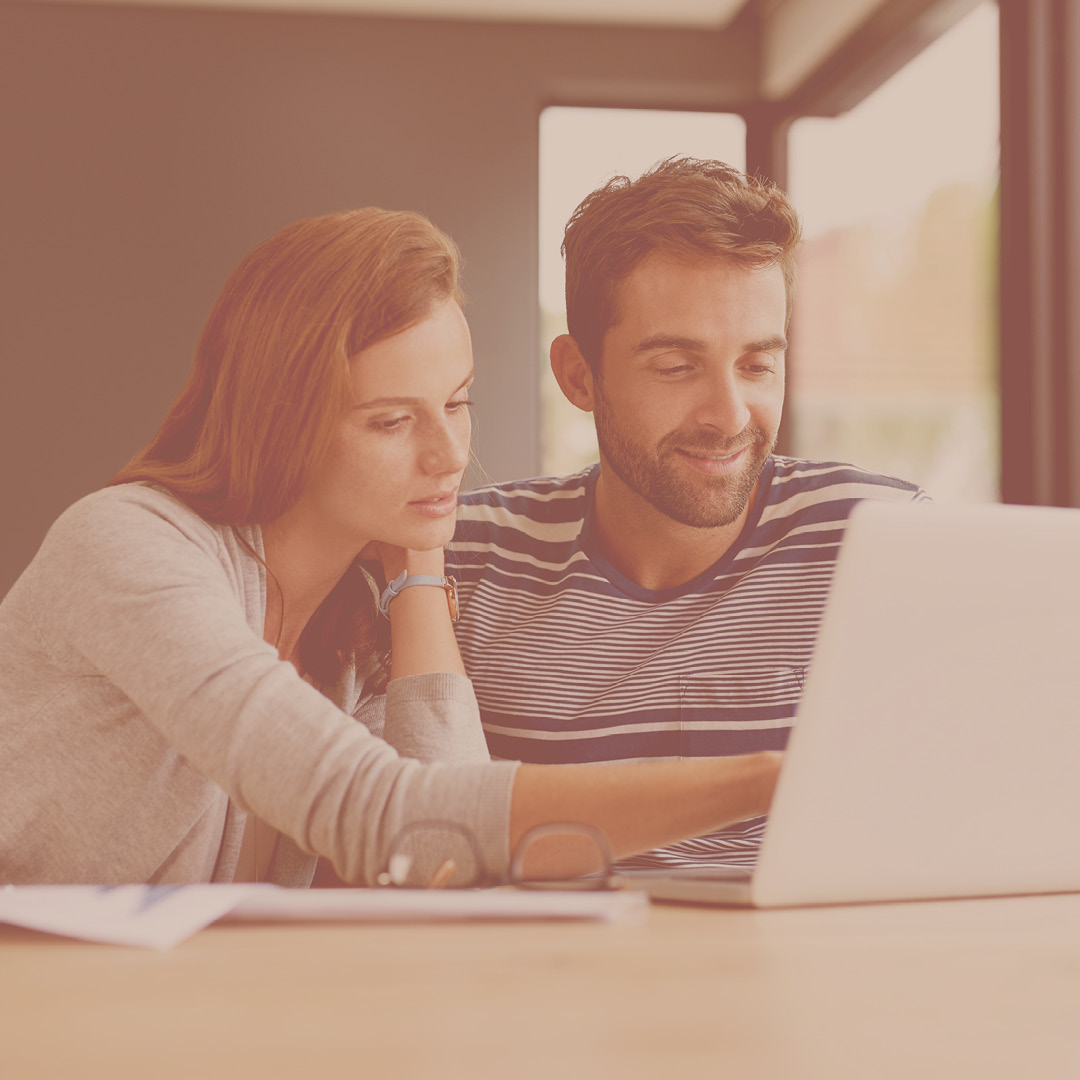 Couple looking at a laptop